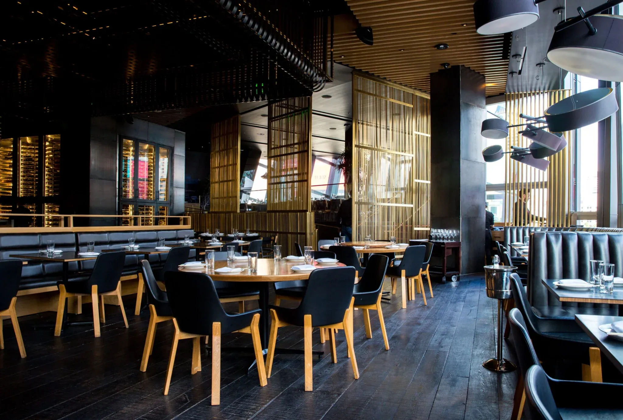 restaurant interior with multiple tables and booth seating